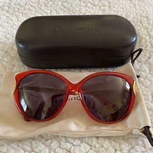 Louis Vuitton red and gold sun glasses.